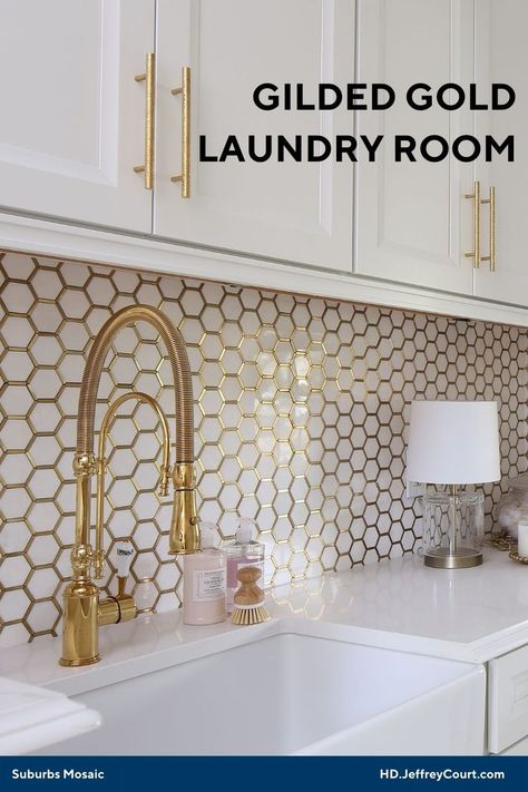 White laundry room sink and countertop with gold hardware showcasing the white marble hexagons with gold metal outlines mosaic on the wall. Tan And White Bathroom, Glam Laundry Room, Top Loader Laundry Room, Elegant Laundry Room, White And Gold Wallpaper, Laundry Room Tile, White Laundry Rooms, Laundry Room Lighting, Home Setup