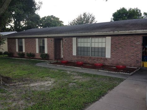 The front of my house needed a drastic facelift and some curb appeal. I really disliked how plain it looked, so this is what I came up with. Staining the brick, adding fresh landscaping and a newly built front porch pergola really seemed to do the trick. Hope you enjoy!   These first two pictures are before. Very plain and unappealing.   Before: Pic 2   I used a semi-transparent concrete stain (English Brick) from Home Depot to give the brick some life again. Here is a side-by-side com… Front Porch Pergola, Porch Pergola, Diy Front Porch, Porch Planters, Diy Porch, Pergola Canopy, Red Brick House, Wooden Pergola, Pergola With Roof