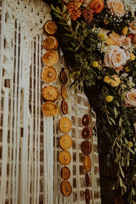 "All the vendors in this styled shoot are not only LGBTQ+ inclusive but also active allies advocating that all love is equal." The post Boho grunge wedding inspiration with orange tones appeared first on Equally Wed, modern LGBTQ+ weddings + LGBTQ-inclusive wedding pros. This post features DIY decor using dried oranges October Wedding Boho, Wedding Decor September, Moody Rainbow Wedding, Diy Forest Wedding Decor, Unique Boho Wedding Ideas, Cozy Modern Wedding, Yule Themed Wedding, Post Modern Wedding, Weasley Wedding Aesthetic