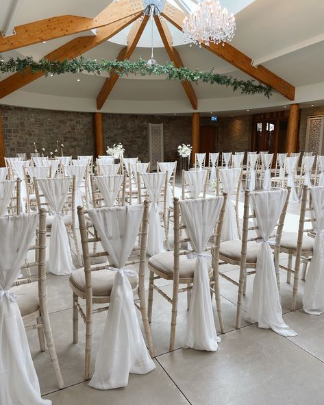 A gorgeous ceremony scene ✨ @sttewdricshouse . . . #wedding #weddingdesign #weddingstylist #eventdesign #weddingdetails #weddingseason #weddingdecor #weddinginspo #weddingvibes #eventinspo #events #southwalesevents #neutralwedding #neutrals #candles #weddingflorals #weddingflowers #weddingday #chivarichairs #chairsashes #ceremony #weddingceremony #aisle #weddingsaisle White Chiavari Chairs Wedding Ceremony, Silver Chairs Wedding, Chavaria Chairs Wedding, Chair Decor Wedding Ceremony, Chivari Chair Draping, Chivari Chair Decor Wedding, Chiavari Chairs Wedding, Ivory Wedding Decor, Chiavari Chairs Decor