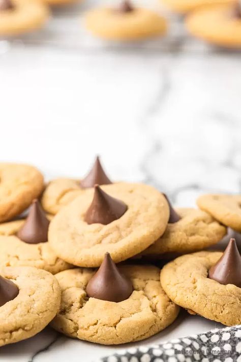 This easy and simple Peanut Butter Kiss Cookies are delicious and simple to make. The entire family will love this Peanut Butter Hershey Kiss Cookie recipe for Christmas! They are the best and are better than any cookies from Betty Crocker. #eatingonadime #cookierecipes #christmascookies Peanut Butter Hershey Kiss Cookies, Peanut Butter Kiss Cookies Recipe, 2023 Cookies, Kiss Cookie, Kiss Cookie Recipe, Peanut Butter Blossoms Recipe, Hershey Kiss Cookies, Peanut Butter Kiss, Peanut Butter Kiss Cookies