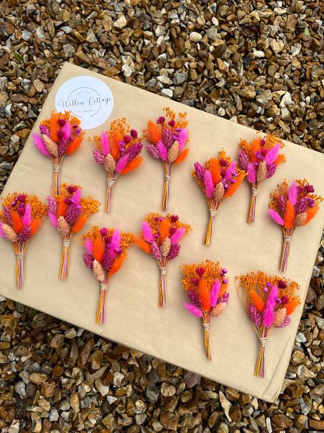 SOLD INDIVIDUALLY PER BUTTONHOLE. Hot pink and orange dried flower buttonhole.  We only use the highest quality dried and preserved flowers in all of our buttonholes and boutonnières, creating stunning accessories for your wedding! Please allow for any slight shade differences due to seasonal availability. Our buttonholes and boutonnières are perfect for both the bride and groom. By using dried and preserved flowers, as opposed to fresh flowers, our buttonholes and boutonnières are the ideal keepsake to treasure and reminisce about your special day! Approx. Measurements: 13cm tall x 9cm wide SOLD INDIVIDUALLY All buttonholes arrive with a pin. **Please check measurements of the buttonhole before ordering** --- PROCESSING & DELIVERY TIME --- Processing time is 1-3 working days Standard deli Outside Wedding Flowers, Pink And Orange Wedding Decorations, Hot Pink Wedding Color Scheme, Dried Flowers Bright, Vibrant Garden Wedding, Pink Orange White Wedding, Pink And Orange Wedding Theme Groomsmen, Orange Pink And Red Wedding, Fuschia And Orange Wedding