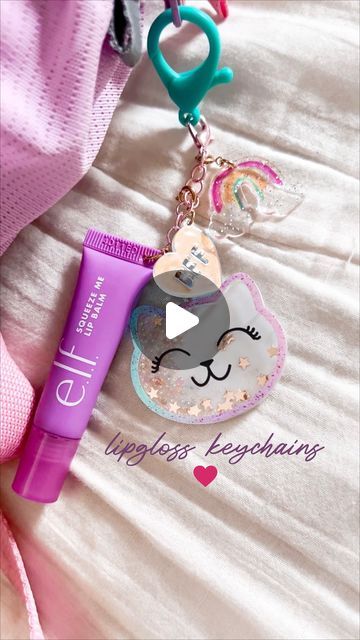 melissa fogelstrom ✨ a Magical Mess® on Instagram: "LIP GLOSS KEYCHAINS

➡️ Comment “SHOP” to have the supplies I used (and some other favorite charms) sent to your inbox! 

But can I just say I want one now too?! They are SO cute!! And would make for such a fun quality time/activity before back to school 🥰

HOW TO:
-poke a hole through bottom of lipgloss (a push pin is a good place to start and then I stretched it a bit more with a scissor)
-cut jewelry chain (I used a bracelet) down to the size you want your chain and add a jump ring and weave that through the lipgloss hole.
-use pliers to tighten that
-add your charms! 

If you have any other questions let me know! Are you going to try making them?! 

•
•
•
#trending #trend #viral #lipglosskeychain #diytutorial #girlsnight #diyactiviti Lip Gloss Keychain Diy, Lipgloss Charms, Lip Gloss Keychain, Lipgloss Keychain, Time Activity, Diy Lip Gloss, Scissor Cut, Halloween Charms, Jewelry Chain