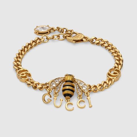 Bracelet with bee pendant and Gucci script in gold-toned metal | GUCCI® US Gucci Bee, Gucci Bracelet, Fall Rings, Bee Jewelry, Bee Pendant, Necklaces And Bracelets, Gucci Fashion, Rose Gold Jewelry, Gorgeous Jewelry