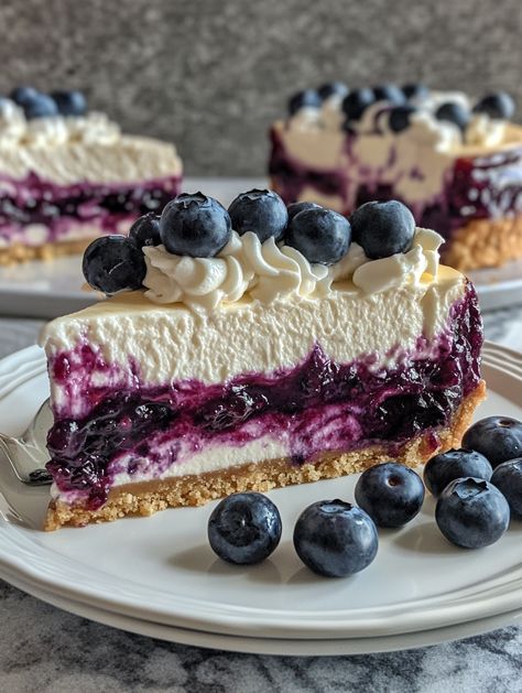 Blueberry Swirl Cheesecake with Silky Topping 🫐   🫐 𝗜𝗻𝗴𝗿𝗲𝗱𝗶𝗲𝗻𝘁𝘀 🫐 - 1 1/2 cups graham cracker crumbs - 1/4 cup granulated sugar - 1/2 cup unsalted butter, melted - 4 (8 oz) packages cream cheese, softened - 1 cup granulated sugar - 1 teaspoon vanilla extract - 4 large eggs - 1 cup sour cream - 1/2 cup heavy cream - 1 cup fresh blueberries - 1/4 cup blueberry jam Blueberry Swirl Cake, Blueberry Swirl Cheesecake, Cheesecake Blueberry, Swirl Cheesecake, Yummy Cheesecake, 귀여운 음식 그림, Homemade Cheesecake, Blueberry Sauce, Blueberry Jam