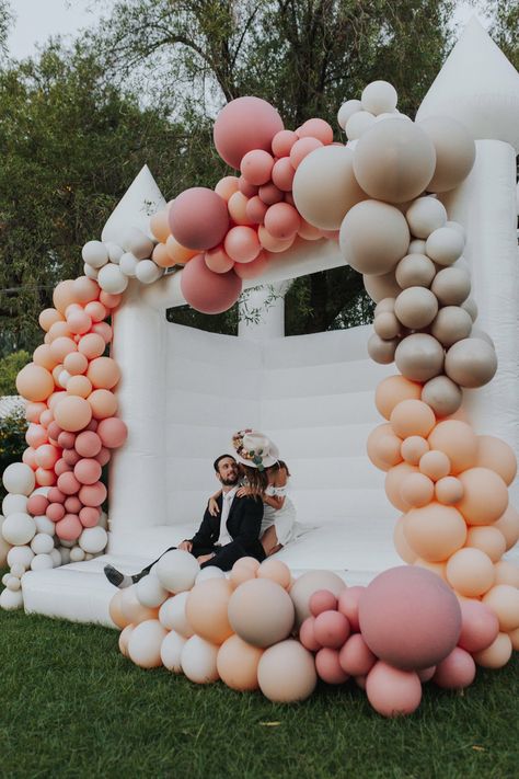 White Wedding bouncy castle with balloon arch from Inflate Forty Eight Wedding Bounce House, Wedding Balloon Arch, White Bounce House, Bouncy House, Wedding Balloon Decorations, Bouncy Castle, Arch Kit, Wedding Balloons, Bounce House