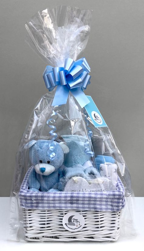 All of our blue baby boy gift baskets are presented in cellophane gift wrap and are hand-finished with a decorative blue bow and curled ribbon. Baskets Christmas, Baby Gift Baskets, Baby Boy Gift Baskets, Basket Gifts, Idee Babyshower, Baby Shower Baskets, Baby Shower Gift Basket, Cadeau Baby Shower, Diy Baby Gifts