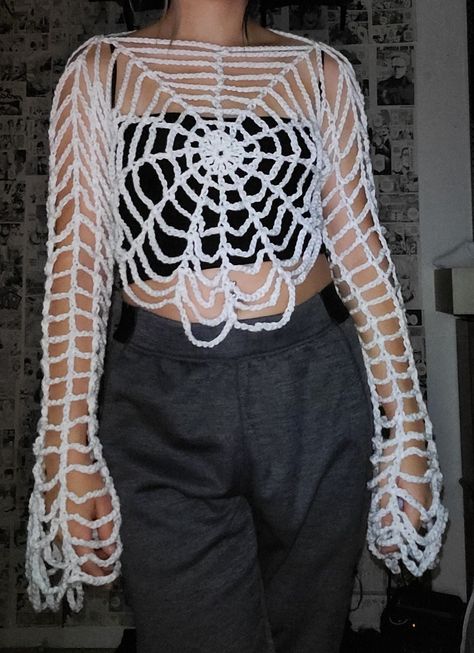 Meticulously handmade crochet spider web top, featuring captivating bell style sleeves. This unique piece is perfect for spooky season. For a personalized touch such as short, long, or bell sleeves, as shown in the photos or different colors feel free to message me. Crochet Spider Costume, Spider Web Shirt Crochet, Crochet Spider Web Shrug, Crochet Spider Web Dress, Crochet Top Bell Sleeve, Crochet Holey Sweater, Crochet Spider Web Gloves, Spider Web Clothing, How To Crochet A Spider Web