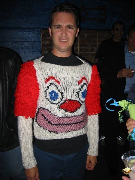 the infamous clown sweater -- This is Wil Wheaton wearing a horrible (and awesome) clown sweater. He’s always good-for-a-laugh, eh? Thank you to my friend Jen Brown for sharing this with me (inspired by this post which features the winning sweater from Bill Cosby’s recent sweater tournament). Ugly Clowns, Ugly Sweater Contest, Wil Wheaton, Ugly Xmas Sweater, Christmas Sweater Party, A Clown, Ugly Christmas Sweater Party, Ugly Sweater Party, Clipuri Video