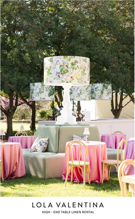 Create a beautiful baby shower, bridal luncheon, mother's day, wedding reception, garden party, or birthday with this garden pattern lamp shade and oversized lamp decor. Pink glassware, Orchid and Apricot Linens, fresh garden flowers, and custom pattern vinyl wrap bar and decor. Table Linens create a retro chic aesthetic reminiscent of classic garden or lawn parties. Contact us at design@lolavalentina.com and we will give you all of the information you need to get started designing your event! Garden Chic Wedding Decor, Rose Garden Theme Party, Shades Of Pink Decor, Farm To Table Decor, Spring Event Decor, Floral Tablecloth Wedding, Garden Party Tablescapes, Oversized Lamp, Wedding Reception Garden