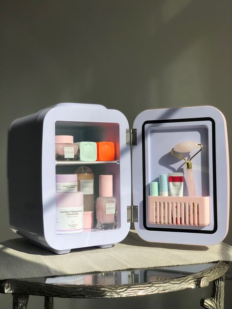 pink skincare fridge with glow recipe products inside. Mini Fridge For Makeup, Mimi Skincare Fridge, Skin Care Holder Aesthetic, Mini Frigerator Organization Skincare, Makeup Fridge Aesthetic, Skincare Freezer, Skin Care Refrigerator, Skin Care Fridge Aesthetic, Skincare Fridge Aesthetic