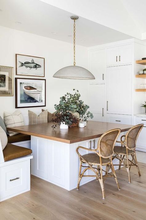 Cottage style L-shaped breakfast banquette and rattan and bamboo chairs sit at a square walnut top breakfast table illuminated by a gray dome chandelier. Essen, Seating In Kitchen, Booth Seating In Kitchen, Dining Booth, Pure Salt Interiors, Kitchen Breakfast Nooks, Pure Salt, Booth Seating, Kitchen Nook