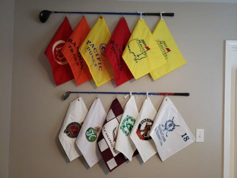 My husband wanted to display his golf flags collection and I came up with this idea to use some clubs he played with in college and tie his flags to it. We love how it turned out! Easy to make. Golf Themed Powder Room, Golf Flag Display Ideas, Golf Flag Display, Flag Display Ideas, Golf Bedroom, Golf Man Cave, Golf Flags, Diy Golf, Golf Simulator Room