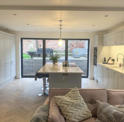 The homeowner opted for the 3 wide pane bifolds for their newly renovated kitchen and we think they made the best decision, creating an open, light and airy space at the hub of the house. It seems the perfect place to enjoy your morning cuppa ☕️ We love the traditional shaker style kitchen vibe but they all need a modern edge with bifolds or sliding doors to compliment the room and create the indoor/outdoor space that all homeowners aim to have, just like this one!⠀ Stone Kitchen Design, Backsplash With Dark Cabinets, Kitchen Diner Extension, Cosy Living, Diy Countertops, Galley Kitchen, Kitchen Extension, Bespoke Kitchens, Trendy Kitchen