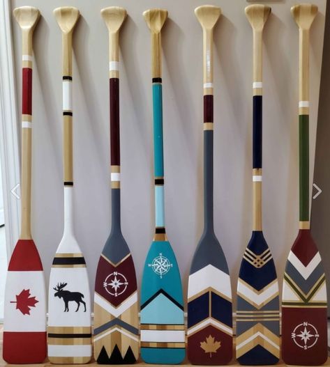 Paddle Painting Ideas, Decorative Oars On Wall, Painted Oars Paddles, Decorative Paddles Painted Oars, Painted Canoe Paddles, Canoe Paddle Art, Canoe Paddles On Wall, Nautical Paddle Decor Painted Oars, Canoe Paddle Decor