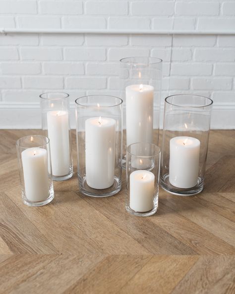 Set of 6. Features Add a little touch of romance with this set pillar candles and glass cylinder vases. Details Color Palette: Wax - whiteVase - clearQuantity:set of 12Dimensions:4x Candle 1 - 6x12in 2x Candle 2 - 6x16in 4x Candle 3 - 4x8in 2x Candle 4 - 4x12in Candle And Bud Vase Centerpiece Wedding, Candles In Glass Cylinders, Candles For Wedding Tables, Floating Candles Centerpieces, Glass Candle Centerpieces, Pearl Wedding Centerpieces, Candle Vases, Round Table Centerpieces, Pilar Candles