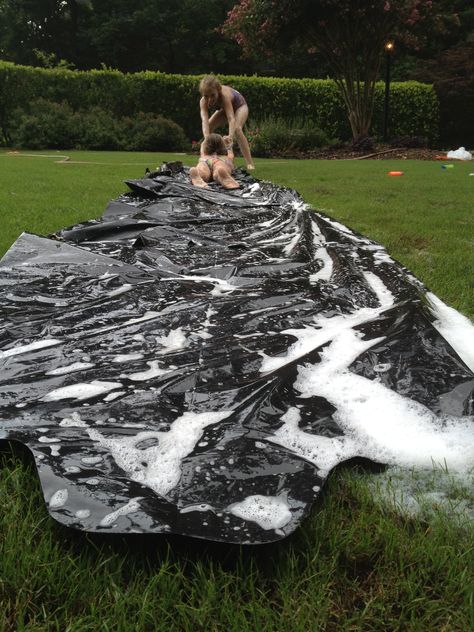 Homemade Slip-n-slide! Perfect for any summer day! Jut tape together garbage bags, secure it with some stakes (the type that hold x-mad lights) lather with soap and water and slide! Perfect DIY craft! Homemade Water Slide, Homemade Slip And Slide, Fun Group Games, Slip N Slide, Kids Indoor Playground, Water Day, Water Party, Summer Fun List, Garbage Bags