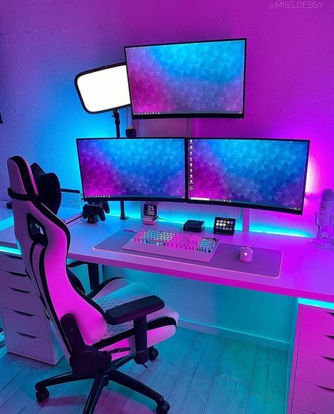 What do you think about this RGB theme? 🤔 [via @miss.debsy] This is a clean triple monitor setup! She is using an Ikea desk with Alex drawers and spacers for extra leg room. The gaming chair matches well with the white overall theme. All three monitors are mounted which saves previous desk space. I like the placement of the third monitor directly above the desk. She is using a Roccat keyboard and a Razer mouse accompanied by an extra-large RGB mousepad. Other gear on the desk includes, a Blue Gaming Area Under Loft Bed, Loft Bed Ideas Gaming, Loft Gaming Bed, Loft Bed With Gaming Desk, Gaming Loft Beds, Gamer Bed Rooms Ideas, Gaming Setup Under Bed, Under Bed Gaming Setup, Loft Bed With Gaming Area