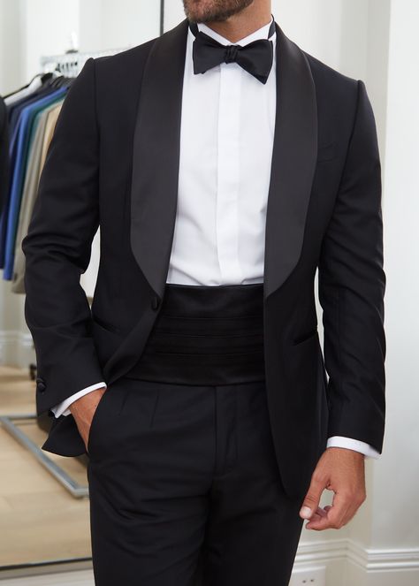 Made from high-quality silk material, this cummerbund boasts a luxurious sheen that will catch the eye of everyone in the room. The rich black colour adds a touch of sophistication and elegance to any tuxedo or formal suit. This cummerbund features an adjustable elastic band for a comfortable and secure fit, ensuring that it stays in place throughout the night. Its classic design with pleated detailing offers a timeless and refined look that complements any dress shirt and bow tie.     	100% Sil Wedding Black Tuxedo For Men, Night Wedding Suits Men, Cumberbun Tuxedo, Elegant Black Suit Men, Classic Tuxedo For Men, Wedding Tuxedo For Men Black, Mens Black Suit Outfit Wedding, Men Tuxedo Styles, Tuxedo Outfits Men