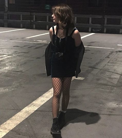 tight dark dress and boots on a roof Club Outfits Fishnets, Grunge Outfits Fishnets, Summer Fishnet Outfit, Fishnets With Dress, Fishnets With Skirt, Casual Fishnet Outfit, Fish Net Tights Outfit Dresses, Shorts And Fishnets Outfits, Skirt And Fishnets Outfit