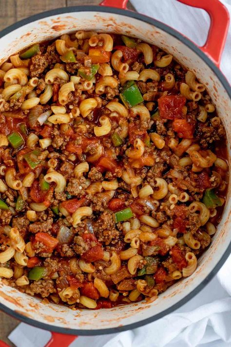 "Classic Goulash made in ONE POT with ground beef, bell pepper, onions, and elbow macaroni in a seasoned tomato sauce, ready in under 45 minutes! We’re always ready to make hearty comfort food, and if you like this goulash you’ll also love this Pot Roast, Slow Cooker Chili, Sloppy Joe, and Baked Million Dollar Spaghetti! Classic Goulash is one of my favorite old fashioned recipes, made with ground beef, onion, bell pepper, and macaroni in a seasoned tomato sauce with Classic Goulash Recipe, Classic Goulash, Easy Goulash Recipes, Resep Pasta, Goulash Recipe, Beef Goulash, Macaroni Recipes, Goulash Recipes, Hamburger Helper