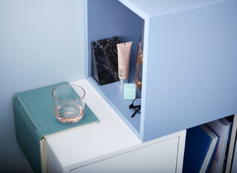 A DIY bedside table setup made of cubic cabinets that hold some cosmetic tubes, a pair of spectacles and a glass. Diy Bedside Table Ideas, Floating Nightstand Ikea, Diy Bedside Table, Diy Bedside, Bedside Table Ideas, Ikea Nightstand, Traditional Bedside Tables, Pretty Pegs, Ikea Eket