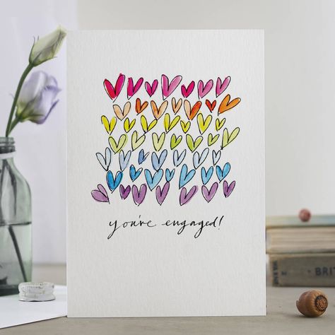 Shower the happy couple with a rainbow of hearts. Celebrate the newly betrothed couple with this fun rainbow You're Engaged card!The illustration was originally drawn by hand with a dip pen, inks and watercolour paints. The modern calligraphy was drawn with an old dip pen and Indian ink.Carbon-neutral print on FSC-accredited art board in a solar powered warehouse. Plastic bottles are banned from the office!Blank inside. You can choose to personalise the card with your special message written in Hand Drawn Cards, Rainbow Card, Newly Engaged Couple, Neutral Prints, Dip Pen, Engagement Cards, Heart Cards, Heart Wedding, Shop Gifts