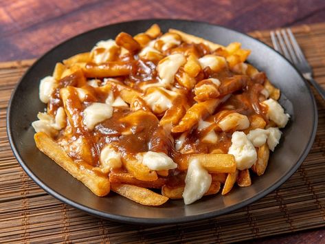 Poutine Might Be the World’s Biggest New Comfort-Food Trend Poutine Fries, Poutine Recipe, Canadian Dishes, Canada Food, Flat Iron Steak, Cheese Curds, Canadian Food, Poutine, Tasting Table