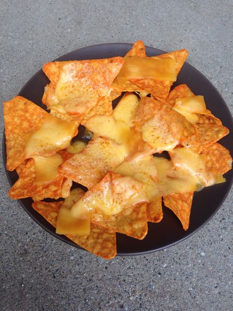 Doritchos...my latest creation.  Just put Doritos on a plate, put cheddar cheese on top and melt in the microwave like nachos.  For an extra treat try dipping them in cottage cheese. Chips And Cheese Nachos, Doritos With Cheese, Nachos With Cheese, Dorito Dip, Tortilla Nachos, Cheese Nachos, Cheese Turkey, Satisfying Snacks, Doritos Nachos