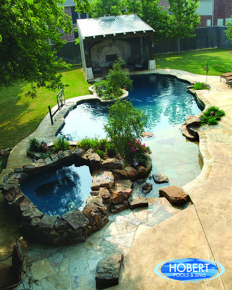 We love the idea of using natural elements to make your pool come to life. This custom pool was inspired by nature. Cottagecore Pool, Cottagecore Backyard, Cheap Inground Pool, Pond Pool, Swimming Pool Pond, Inground Pool Landscaping, Pool Pond, Geometric Pool, Beach Entry Pool