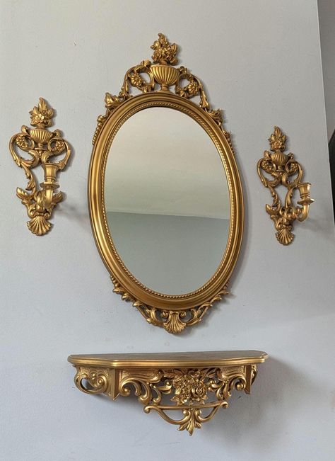 Vintage Victorian style 1960's gold syroco oval mirror set with shelf and candle holders. Plastic frame. Shelf has some pinhole size paint splatters on top (shown in pictures). Measurements: mirror- 31" length × 16" width shelf- 19" length × 6 1/2" height × 8" depth candle holder- 13 1/2" length × 5 1/2" width × 5 1/4" depth *Please understand that these are previously loved vintage items, so they will come with their naturally aged wear and charm* Victorian Shelves, Shelf Length, Pvc Canopy, Family Pictures On Wall, Hall Mirrors, Wall Mirror With Shelf, Country Vintage, Paint Splatters, Frame Shelf