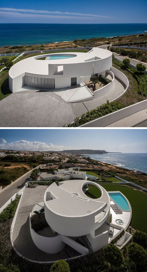 Mario Martins Atelier have designed this modern and sculptural house in Luz, Portugal, that's based on the geometric shape of an ellipse. Futurist Architecture, A Modern House, Landscape Architecture Design, Architecture Design Concept, Scandinavian Interior Design, Village House Design, Modern Architecture House, Traditional Architecture, Futuristic Architecture