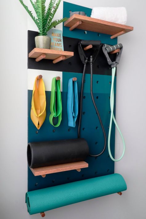 Keep your home exercise equipment accessible—and out of the way—with these space-efficient storage solutions. Organize Workout Equipment, Gym Wall Storage, Workout Gear Storage, Exercise Ball Storage, Fancy Garage, Basement Update, Fitness Storage, Yoga Storage, Home Exercise Equipment