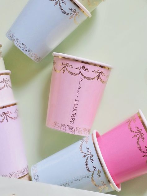 We're delighted to collaborate with Laduree, the restaurant, tea room and macaron specialist, to carry these beautiful cups. The exquisite colours, gold foil design and borders are so stylish. Details Gold foil details Each set includes a blue, cream, pale pink, pale purple, mint, pale blue, pink and pale mint cup Suitable for hot or cold drinks Made from sustainable FSC paper Pack of 8 in 8 colours Product capacity: 9oz French Themed Birthday Party, French Themed Birthday, Paper Cup Design, Laduree Paris, Beautiful Cups, Cross Decor, Cafe Concept, Gold Foil Design, Wedding Gift Guide