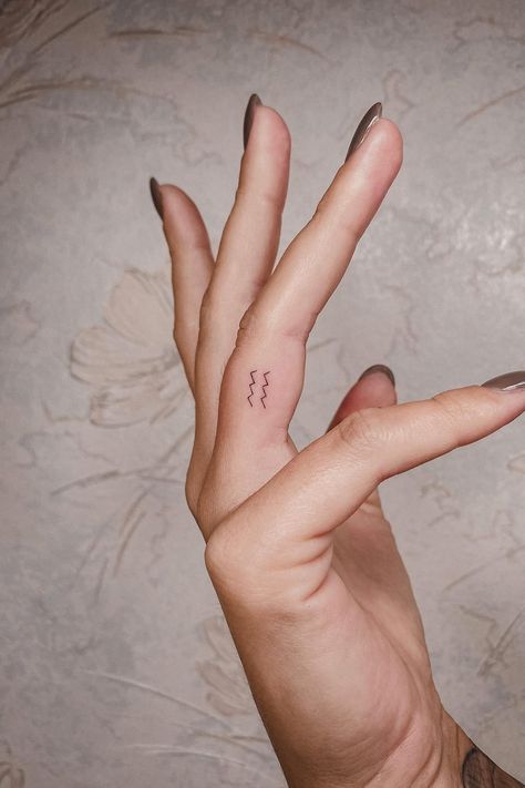 Mini Aquarius Tattoo, Aquarius Tattoo Small Zodiac Signs, Small Zodiac Tattoos Aquarius, Aquarius Tattoo Finger, Aquarius Tattoo Fine Line, Aquarius Finger Tattoos For Women, Finger Tattoos Aquarius, Minimalist Tattoo Aquarius, Small Tattoos Aquarius