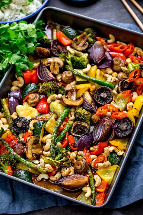 This spicy dish of Asian Mushrooms incorporates a rainbow of veggies! All cooked together on one tray in the oven. It totally hits the spot for a healthier takeout alternative. A great Meatless Monday idea. #vegetariandinner #vegetarianrecipe #onepan #sheetpandinner #onepot #asian #asianvegetables #easyvegetariandinner Asian Mushrooms, Healty Dinner, Easy Vegetarian Dinner, Asian Vegetables, Spicy Dishes, Sheet Pan Dinners, Idee Pasto Sano, Cooking Together, Sheet Pan Recipes