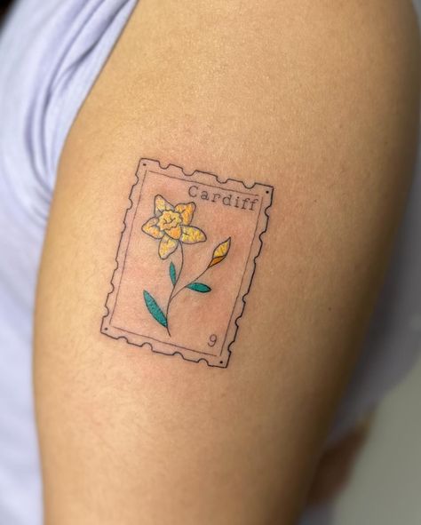 Crayon stamp tattoo to celebrate time in wales I am booking April onwards, DM TO ENQUIRE ABOUT YOUR NEXT TATTOO 💖 . . . . . . . #stamp #stamptattoo #bristol #bristoltattoo #bristoltattooartist #bristoltattoostudio #tattoo #tattoos #uktattoo #tattoouk #daffodil #fineline #finelinetattoo #finelinetattoos #colourtattoo #tattooideas #tatt #patchworktattoo . Would you get a stamp tattoo? Nature, Daffodil Stamp Tattoo, Madeleine Tattoo, Wales Tattoo, Daffodil Tattoo, Tattoo Uk, Stamp Tattoo, Scary Tattoos, Next Tattoo