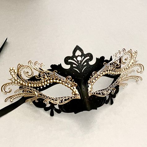 The chic black gold mask is alluring, embedded with rhinestones to make you look glamorous at any function. Black Lace Masquerade Mask, Luxury Eye Mask For Masquerade, Masquerade Masks Black, Masquerade Black And Gold, Black Masquerade, Masquerade Jewelry, Black Masquerade Mask Aesthetic, Mascarade Mask Ideas, Black And Gold Mask