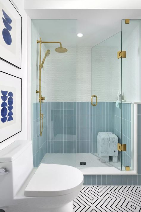 You usually see showers with a single tile installed from floor to ceiling, but this blue shower goes against the grain, boasting a pale blue rectangular tile on the bottom and a white penny mosaic on the top. Think of it as wainscoting, but for your shower. #Bathroom #ShowerIdeas #BlueBathroom #MyDomaine Blue Shower Tile, Blue Bathroom Tile, Wainscoting Bathroom, Bathroom Powder Room, Park House, Unique Shower, Shower Niche, Gorgeous Bathroom, Blue Tile