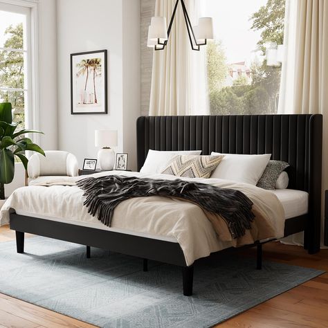 The bed frame is beautifully upholstered in soft velvet and features a wingback headboard design, adding a stylish touch of glamour to any home decor. Velvet Bed Frame, Tufted Wingback Headboard, Black Bed Frame, Lit King Size, Black Headboard, King Size Bed Frame, Wingback Headboard, Black Bedroom, Queen Size Bed Frames