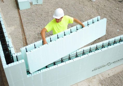 ICF forms being set by a construction worker Icf Blocks, Icf Walls, Icf Home, Insulated Concrete Forms, Concrete Forms, Concrete House, Passive House, Traditional Building, New Home Builders