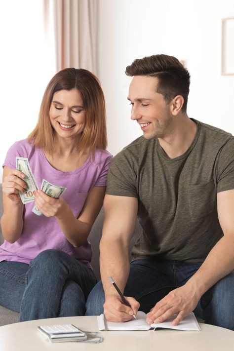 Couple sitting on couch in front of table counting money and writing in note book. Tips For Couples, Money Management Tips, Managing Money, Credit Card Balance, Management Strategies, Investment Accounts, Successful Relationships, Payday Loans, Saving For Retirement