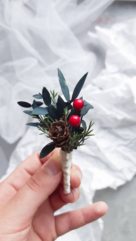 Flower hair comb and boutonniere for winter wedding, Christmas and holiday season. Materials: artificial flowers, pine cones, greenery, beads. The actual colors may slightly differ from the colors you see on your screen, as it depends on the specific monitor settings. In case some materials are out of stock, they may be replaced with a similar one. Matching boutonniere, flower bracelet, hair crown can be made to order along with this accessory here: https://www.etsy.com/listing/735358517 This an Greenery Hair Piece, Winter Boutonniere, Christmas Wedding Bouquets, Christmas Wedding Flowers, Christmas Wedding Themes, Christmas Wedding Inspiration, Winter Wedding Hair, Cone Crafts, Rustic Winter Wedding