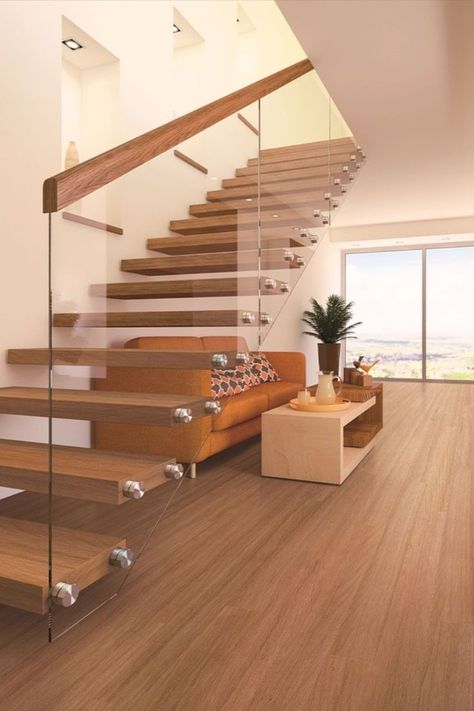 Floating floorboards installed in a living area, also featuring large sliding glass doors and a modern staircase. Floating Floorboards, Floor Boards, Engineered Flooring, Blue Space, Timber Flooring, Tongue And Groove, Small Room, Tile Samples, Coastal Homes