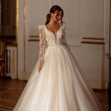 Introducing “Aria,” a breathtaking ballgown wedding dress. With full lace sleeves and an elegant deep sweetheart neckline, it exudes timeless beauty. The tulle skirt adds a touch of whimsy, while floral lace on the bodice enhances its allure. “Aria” is the perfect choice for brides seeking a blend of sophistication and romantic charm on their special day. Book today to view. www.thebridalhouse.co.za #weddingdress #winterwedding #bridalboutique #bridetobe #weddinginspiration Champagne Wedding Dresses, Modern Bridal Dress, Wedding Dresses Long Sleeve, Glitter Champagne, Wedding Dress Champagne, Womens Wedding Dresses, Applique Wedding, Applique Wedding Dress, Wedding Dress Fabrics