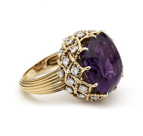 Mounted with a large amethyst in a gold rope twist gallery hung with brilliant cut diamonds, to reeded gold shank Cartier, Paris, Signed, Hallmarked and Numbered Amethyst 18mm cross Rings Purple, Cartier Accessories, Amethyst Rings, Amethyst And Diamond Ring, Purple Jewelry, Diamond Cocktail Rings, Discount Jewelry, Amethyst Jewelry, Cheap Jewelry