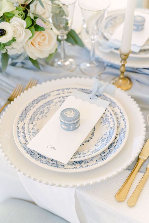 A close up of the blue Wedgwood trinket box fine art wedding favours resting upon the menu at each guest's place setting. | Planner: @bygraceweddings | Photography: @desireeanorth Wedding Favors At Place Setting, Wedgwood Blue Wedding, Wedding Table Wear, Unique Place Settings, Blue And White Place Settings, Place Setting Ideas Wedding, Chinaware Blue Wedding, Blue Wedding Place Settings, Wedding Plate Settings