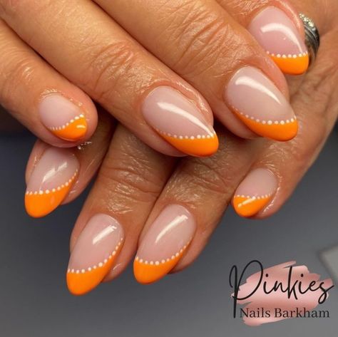 Top 19+ Orange Nail Designs to Try in 2024 That You Can’t Miss Orange And Brown Nail Designs, Orange Holiday Nails, Neon Orange Nail Designs, Orange Nails With Design, Nail Inspo Orange, Short Orange Nails, Orange And White Nails, Orange Gel Nails, Orange Nails Acrylic