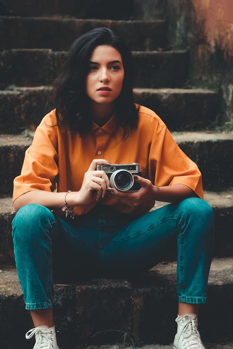 Woman Sitting on Stairs Holding Camera Photographer Self Portrait, Girls With Cameras, Poses Women, Budget Tips, Stylish Photo Pose, Photo Pose Style, Human Poses Reference, Human Poses, Wow Art