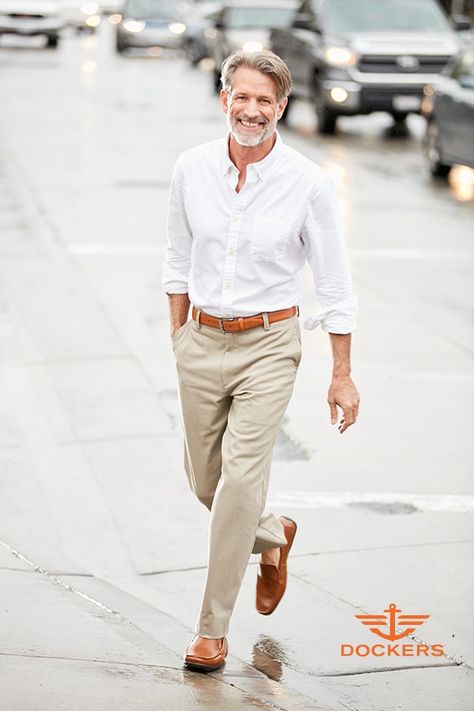 Khaki pants and a white button-up shirt are an iconic menswear combination. What keeps this look fresh instead of boring? The perfect fit. For a casual but put-together look, he can’t go wrong with a relaxed shirt tucked into the perfect flat-front Dockers easy khakis. Best of all? They have stretch for performance, so they’ll be comfortable from day to night. Get new spring style for him at Kohl’s. Look Casual Hombre, Fashion For Men Over 40, Khaki Pants Outfit, Men Over 50, Jeans Trend, Older Man, Dockers Pants, Shirt Tucked In, Mode Casual